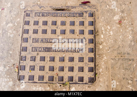 J & S Eyres Non Rocking Manchester square iron manhole cover on the street in Stone Town Zancibar City Zanzibar Tanzania