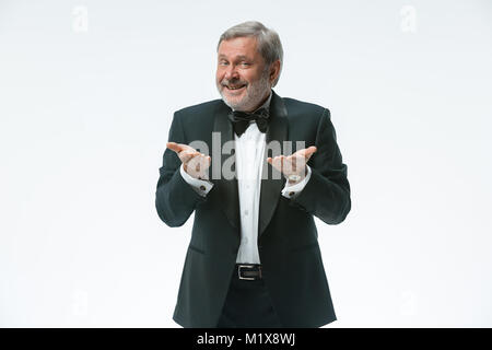 older businessman in a suit with a bow tie, isolated over white Stock Photo