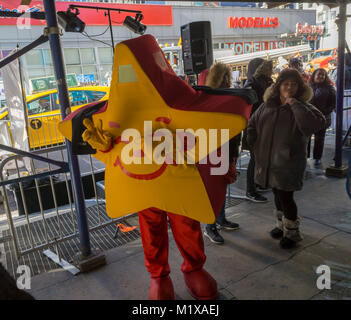 The Carl's Jr. mascot entertains the crowd on line waiting to get into the Carl's Jr. location in Midtown Manhattan in New York on its grand opening, Wednesday, January 31, 2018. The fast food chain with over 1300 restaurants is entering the competitive New York market. The chain, operated by CKE Restaurant Holdings (which also owns the Hardee's brand) has less than 10 of its franchises east of Oklahoma. (Â© Richard B. Levine) Stock Photo