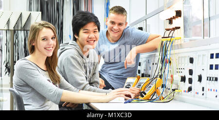 group of cheerful young students in vocational education and training for electronics Stock Photo