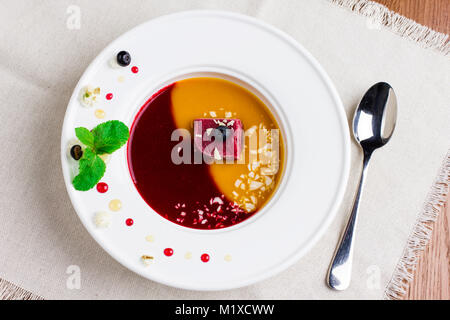 Organic raw food vegan berry ice cream soup in the bowl Stock Photo