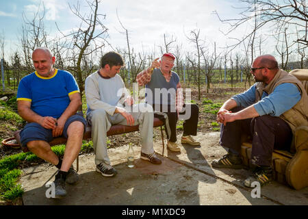 Zrenjanin, Vojvodina, Serbia - March 20, 2017: People are sitting and having casual talk, senior is talking. Stock Photo