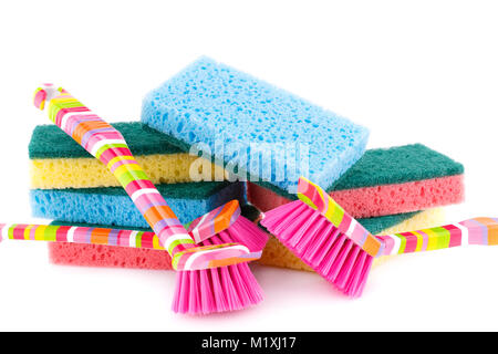 Colorful sponges and brushes isolated on white background. Stock Photo