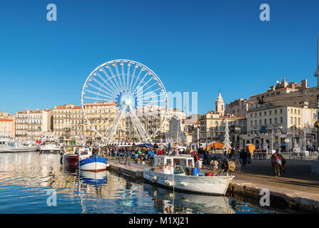 Marseille, France - December 4, 2016: Fish market in Old Vieux Port is the popular tourist attraction in Marseille, Provence, France. Fishing boats in Stock Photo