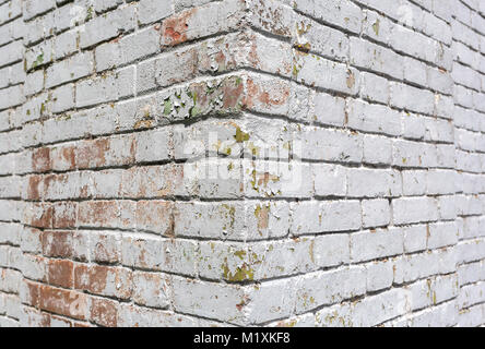 House corner, brick wall painted with white paint. Stock Photo