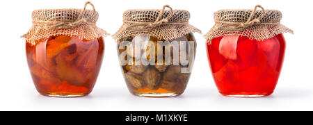 Three jars of jam and honey on white background Stock Photo