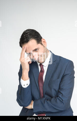 A smartly dressed man conveys a range of facial and bodily emotions, portrait/isolated  on a white background Stock Photo
