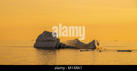 Icebergs in Greenland during sunset. Stock Photo