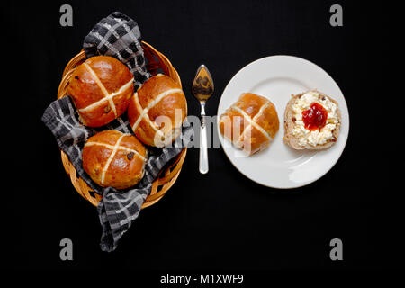 Easter Hot Cross Buns with jam and clotted cream Stock Photo