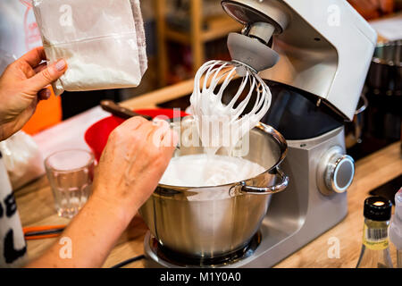 Whipping eggs for meringue cake Stock Photo