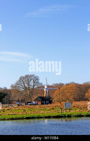 A view over the River Ant towards Dilham Dyke Drainage Mill on the Norfolk Broads from Wayford Bridge, Stalham, Norfolk, England, United Kingdom. Stock Photo