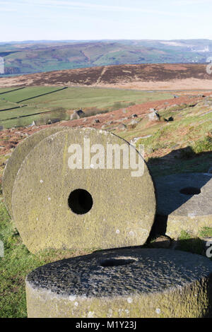 UK, Derbyshire, Peak District Nationa Park, discarded millstones at Stanage Edge. Stock Photo