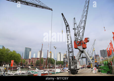 ROTTERDAM, THE NETHERLANDS - 18 AUGUST: People around Maritime Museum in Historical Leuvehaven, Rotterdam's oldest sea port. Harbor and modern apartme Stock Photo