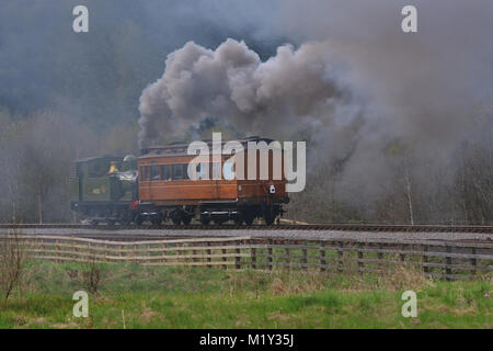 Running bunker first, LNER Class J72 No 69023 'Joem' makes a smoky departure from Levisham station on the North Yorkshire Moors Railway. Stock Photo