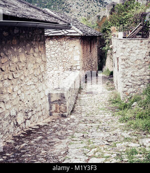 Medieval cobblestone street in a small Bosnian town of Pocitelj Stock Photo