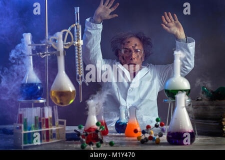 sad scientist with a failed experiment after the explosion in the lab Stock Photo