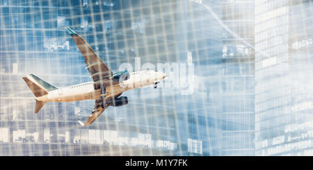 White plane flying on background of blurred skyscrapers and binary key Stock Photo