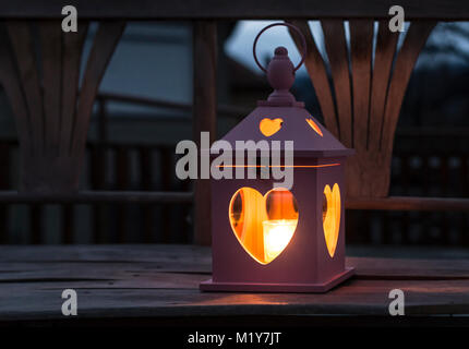 Heart shaped lantern and candle Stock Photo