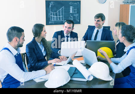 spanish team of architects working and brainstorming in office Stock Photo