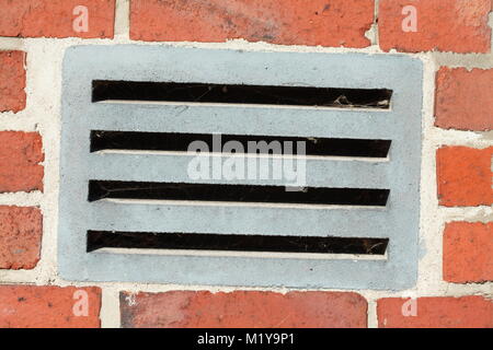 outside ventilation slits on a red brick wall Stock Photo