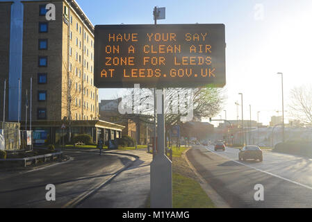 traffic passing digital advert asking for public consultation on a clean air zone for leeds city centre yorkshire united kingdom Stock Photo