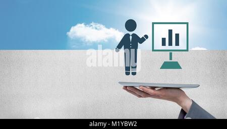Hand holding tablet with businessman icon presenting chart screen Stock Photo