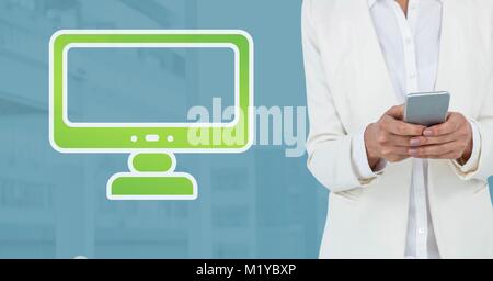 Hand holding phone with computer icon Stock Photo