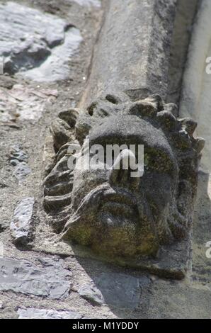 St Michaels and All Angles Church, Victorian Neo Gothic Architecture. Carved Stone Face, Corble Sculpture. Heavitree, Exeter, Devon, UK. Stock Photo