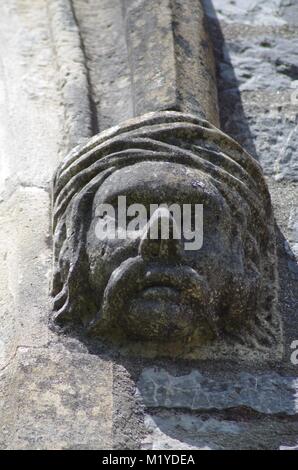 St Michaels and All Angles Church, Victorian Neo Gothic Architecture. Carved Stone Face, Corble Sculpture. Heavitree, Exeter, Devon, UK. Stock Photo