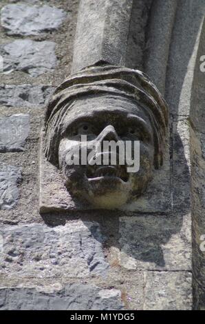 St Michaels and All Angles Church, Victorian Neo Gothic Architecture. Carved Stone Face, Corble Sculpture. Heavitree, Exeter, Devon, UK. Stock Photo