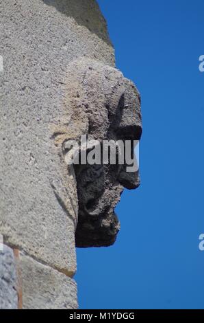 St Michaels and All Angles Church, Victorian Neo Gothic Architecture. Carved Stone Face, Corble Sculpture. Heavitree, Exeter, Devon, UK. Stock Photo