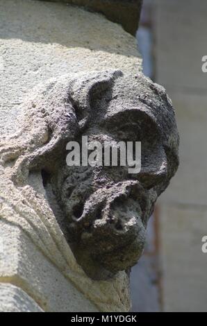 St Michaels and All Angles Church, Victorian Neo Gothic Architecture. Carved Stone Face, Corble Sculpture. Heavitree, Exeter, Devon, UK. Stock Photo