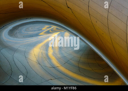 Abstract shapes and patterns found in reflecting light at the metal sculpture known as Cloudgate in Chicago. Stock Photo