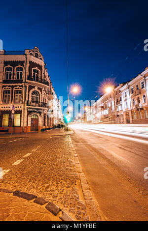 Gomel, Belarus - March 23, 2017: Evening street Sovetskaya with traffic and traces of headlights on the road Stock Photo