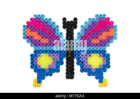Butterfly doll shape made from plastic beads Stock Photo