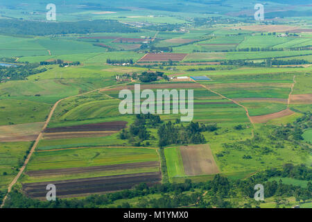 Flying birds-eye view farmlands crops plowed fields dams valley  landscape summer green photo.
