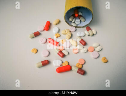 Medication white and colorful tablets arranged abstract on white color background. capsule pills for design. Health, treatment, choice healthy lifesty Stock Photo
