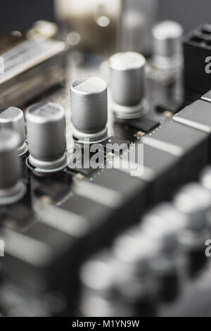 Capacitors Close Up. Computer Motherboard Background. Printed Circuit Board. Stock Photo
