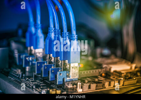 Close up details of mining rig, graphics cards cables and motherboard and network connecton Stock Photo