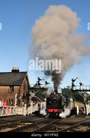 SR Schools class No 30926 'Repton' makes a smoky departure from Grosmont with the 10.30 to Pickering, running late due to brake problems. Stock Photo