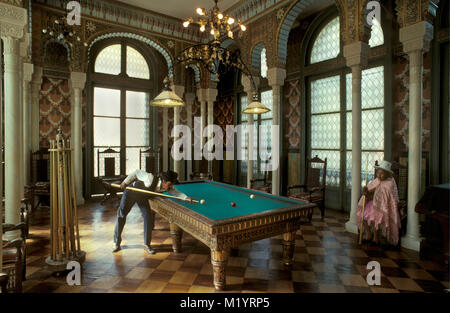 Bolivia. Cochabamba. Man and woman playing billiards in palacio, palace Portales. A copy (replica) of the Alambra Palace in Granada in Spain. Stock Photo