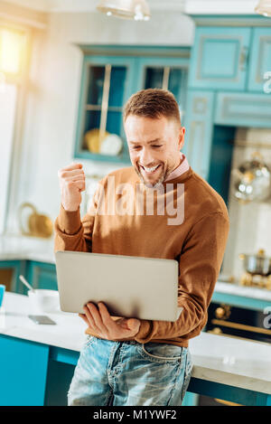 Happy nice man expressing his emotions Stock Photo