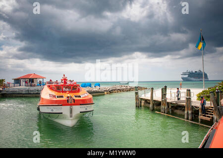 Lifeboat cruising with passengers eager to get to the shore Stock Photo