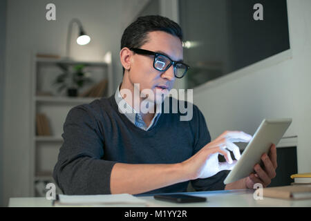 Professional male programmer writing program Stock Photo