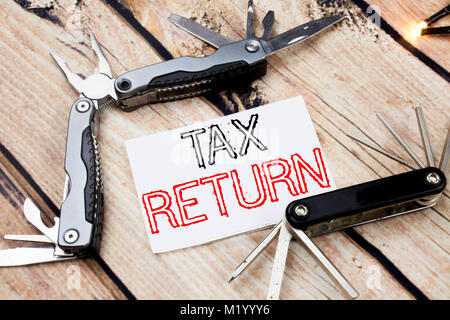 Conceptual hand writing text caption inspiration showing Tax Return. Business concept for Accounting Money Return written on old wooden background wit Stock Photo