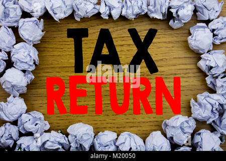 Handwriting Announcement text showing Tax Return. Business concept for Accounting Money Return written on wooden wood background with on old backgroun Stock Photo