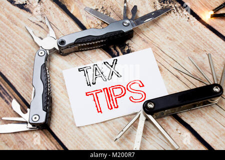 Conceptual hand writing text caption inspiration showing Tax Tips. Business concept for Taxpayer Assistance Refund Reimbursement written on old wooden Stock Photo