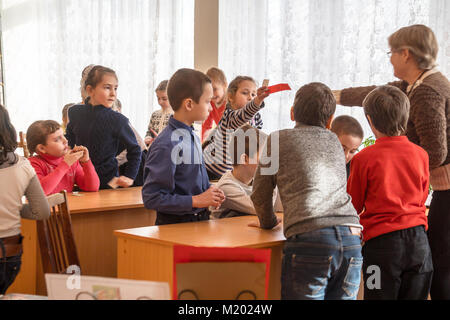 CHAPAEVSK, SAMARA REGION, RUSSIA - JANUARY 31, 2018: School kids of elementary school in the classroom with a female teacher Stock Photo