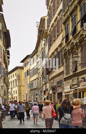 FLORENCE, ITALY - SEPTEMBER 16, 2017: Tourists in a busy street in Florence; the capital of the Italian region of Tuscany Stock Photo