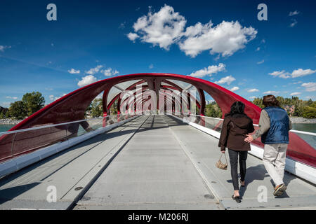 Strollers at Peace Bridge, pedestrian bridge over Bow River near downtown Calgary, Alberta, Canada Stock Photo